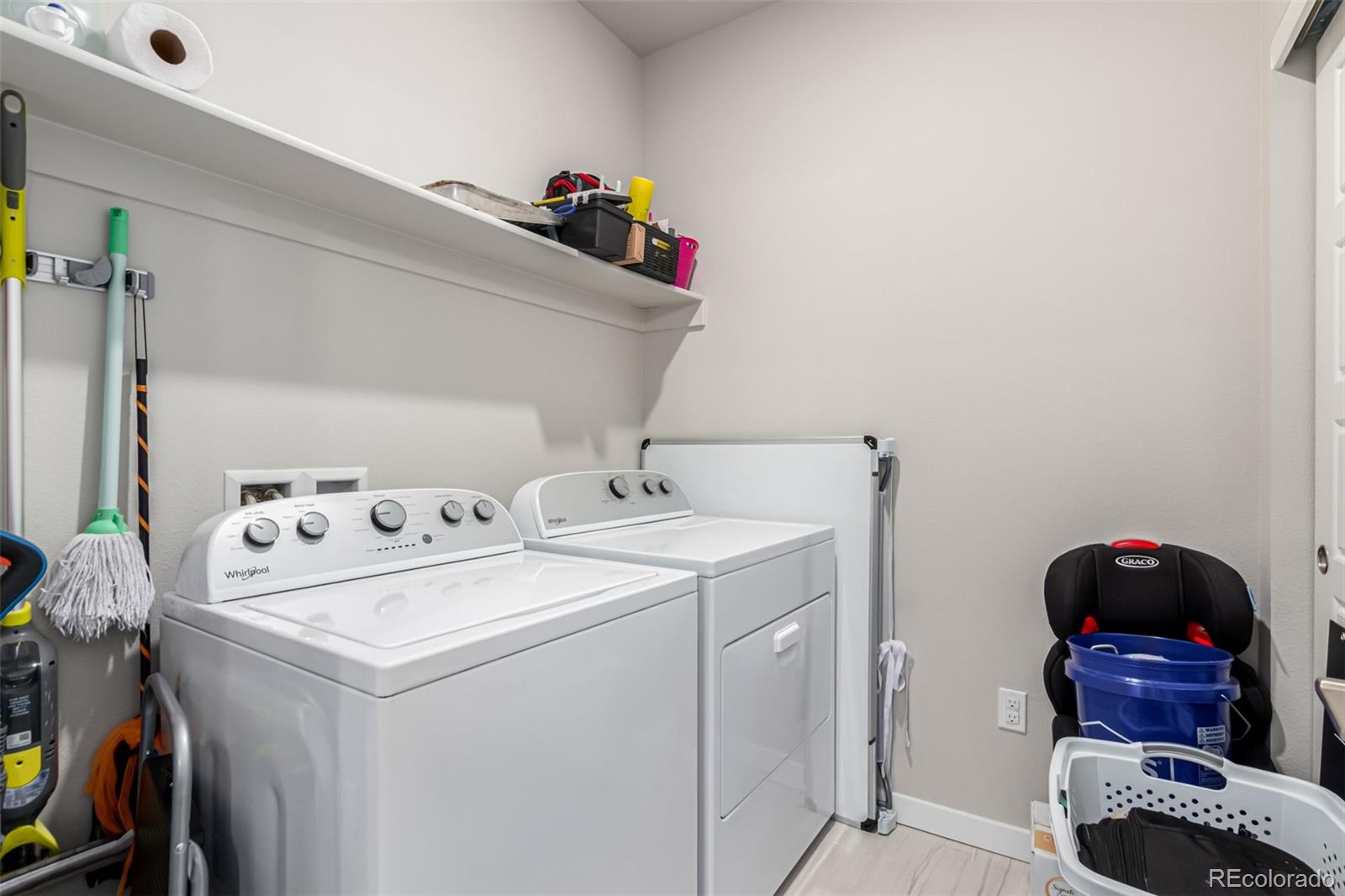 9287 Twenty Mile Road, Unit 204 Parker, CO 80134 - Photo 21 of 30 a utility room with dryer and washer
