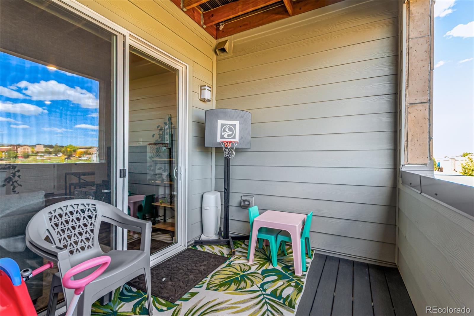 9287 Twenty Mile Road, Unit 204 Parker, CO 80134 - Photo 22 of 30 a view of balcony with two chairs and a potted plant