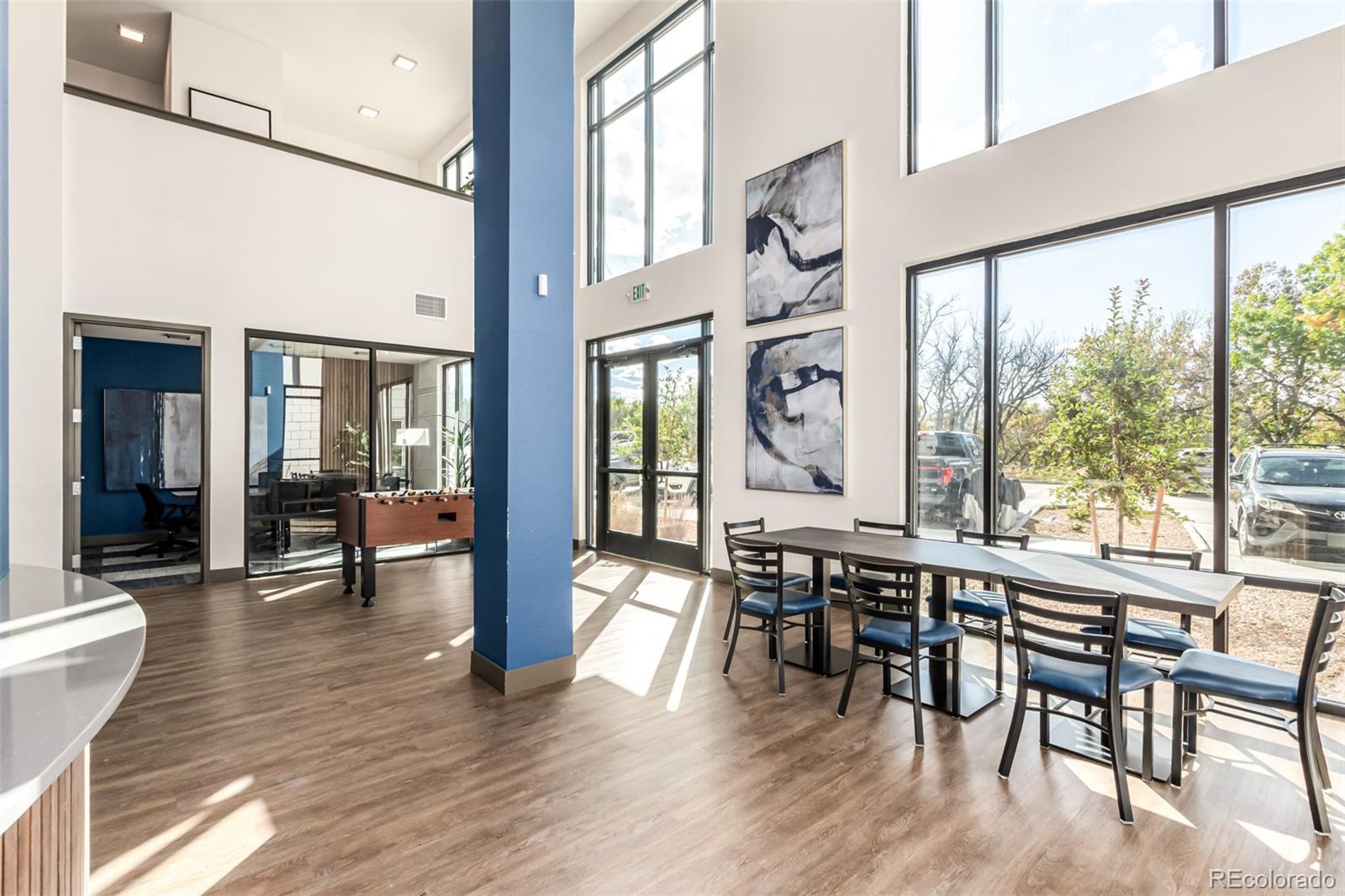 9287 Twenty Mile Road, Unit 204 Parker, CO 80134 - Photo 25 of 30 a view of a dining room with furniture window and wooden floor