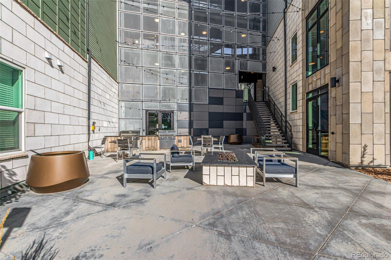 9287 Twenty Mile Road, Unit 204 Parker, CO 80134 - Photo 28 of 30 a view of terrace with seating space and building view