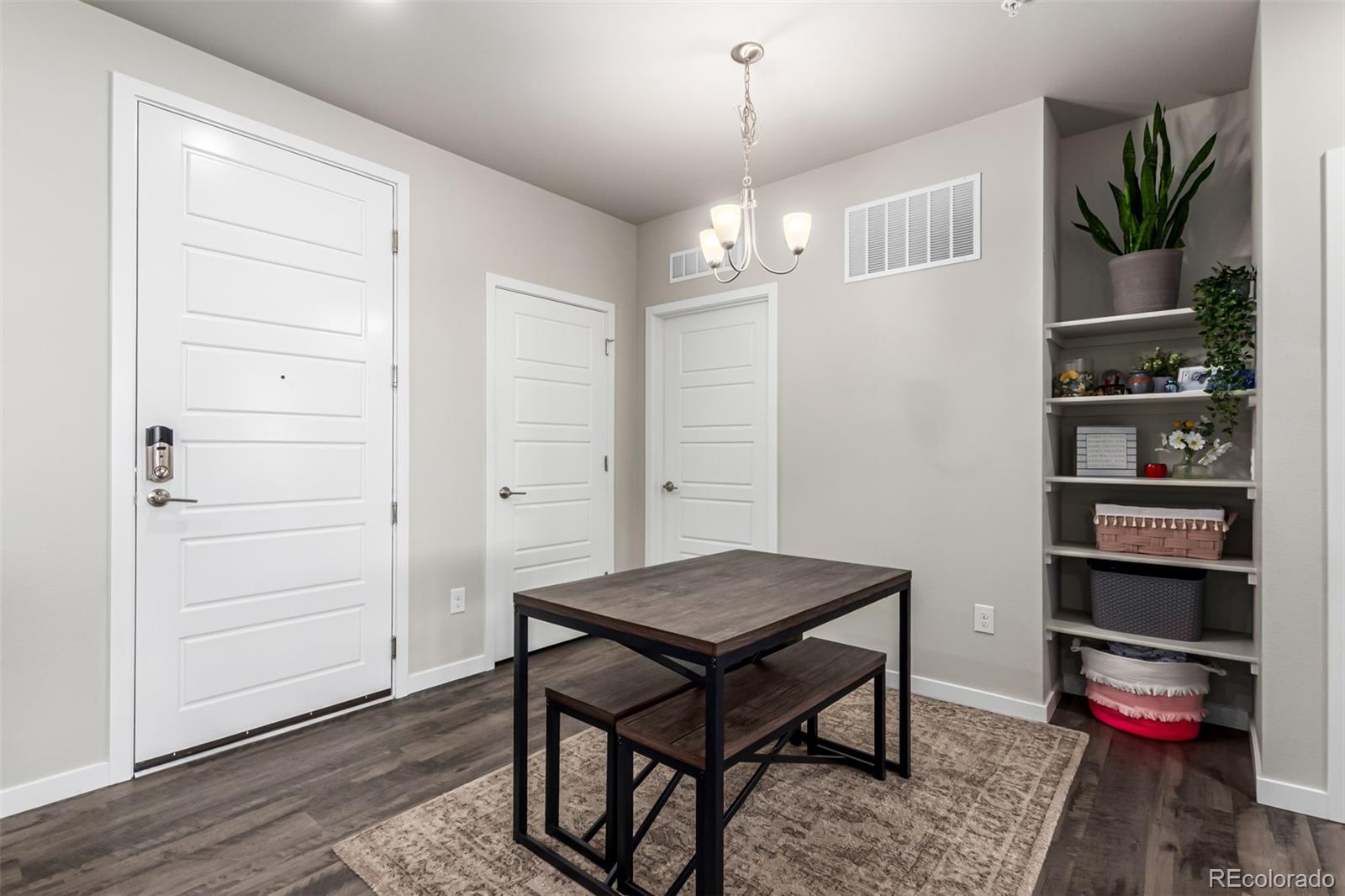 9287 Twenty Mile Road, Unit 204 Parker, CO 80134 - Photo 6 of 30 a view of a livingroom with furniture and cabinet