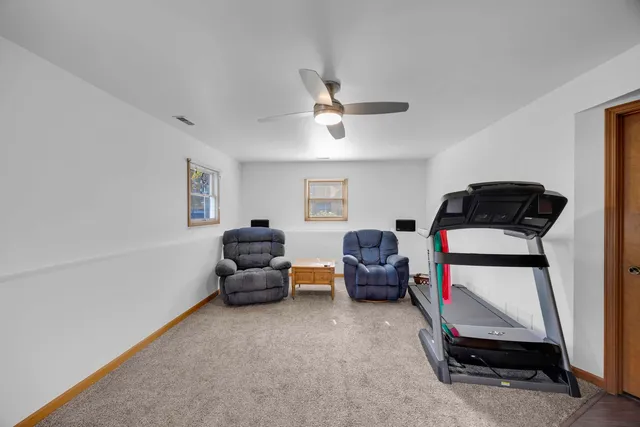 a bedroom with bed and a couch