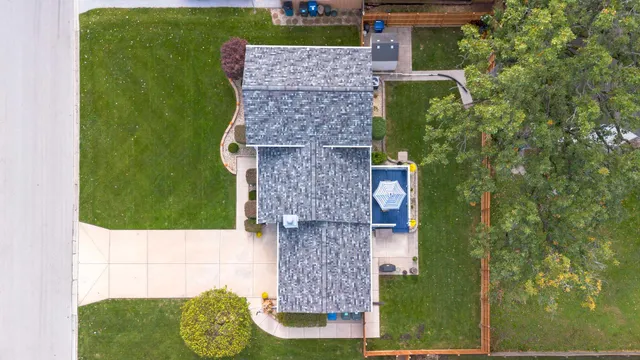 an aerial view of houses with outdoor space