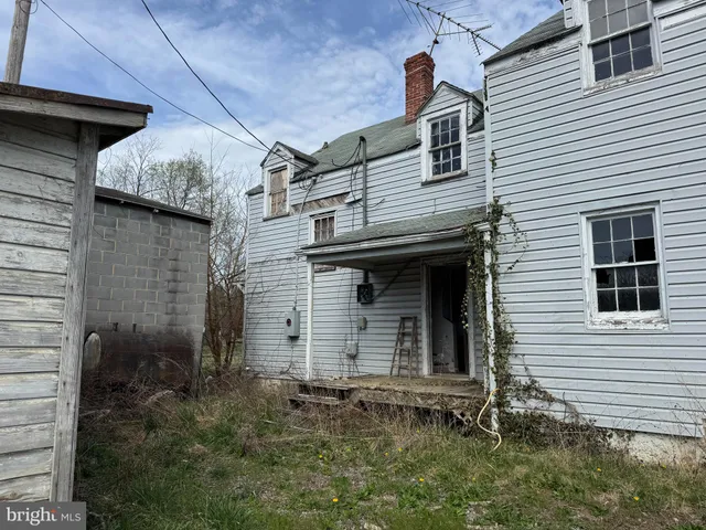 a front view of a house with brick walls