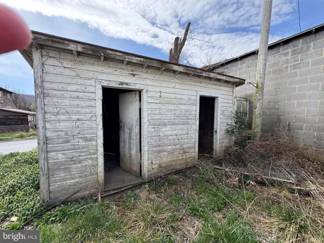 a view of house with yard and entertaining space