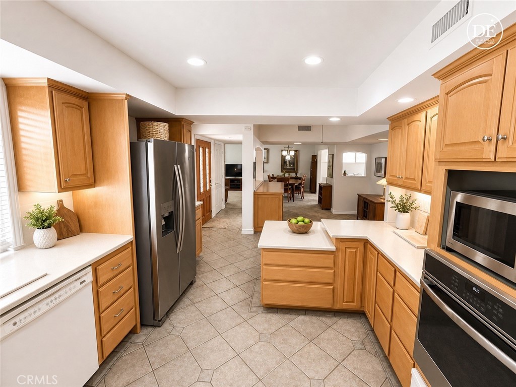 11582 Foster Road Los Alamitos, CA 90720 - Photo 12 of 26 Kitchen to Dining
Note: This photo has been digitally enhanced by AI