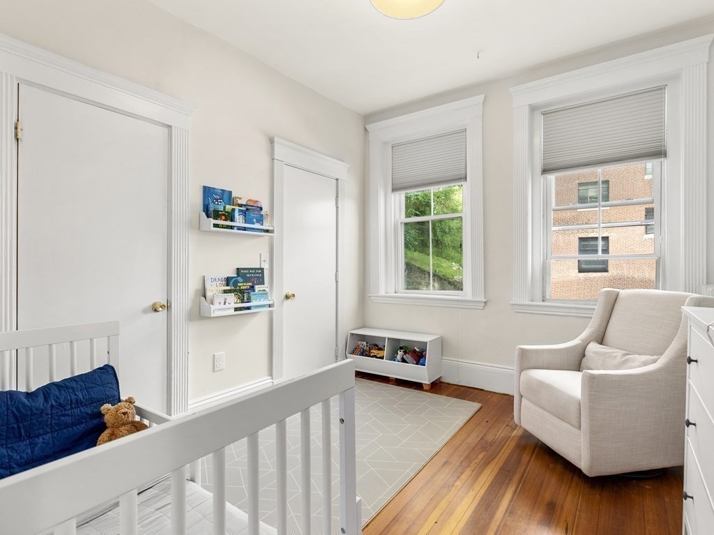 640 Washington Street, Unit 1 Brookline, MA 02446 - Photo 11 of 18 a living room with furniture and wooden floor