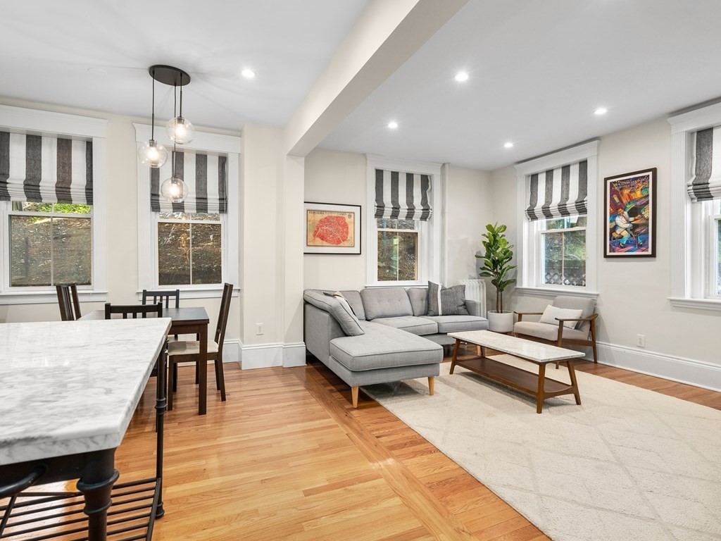 640 Washington Street, Unit 1 Brookline, MA 02446 - Photo 4 of 18 a living room with furniture and wooden floor