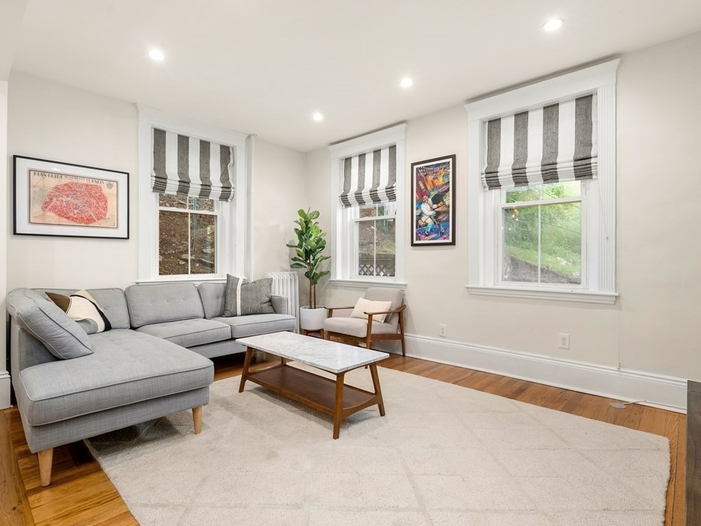 640 Washington Street, Unit 1 Brookline, MA 02446 - Photo 6 of 18 a living room with furniture and a window