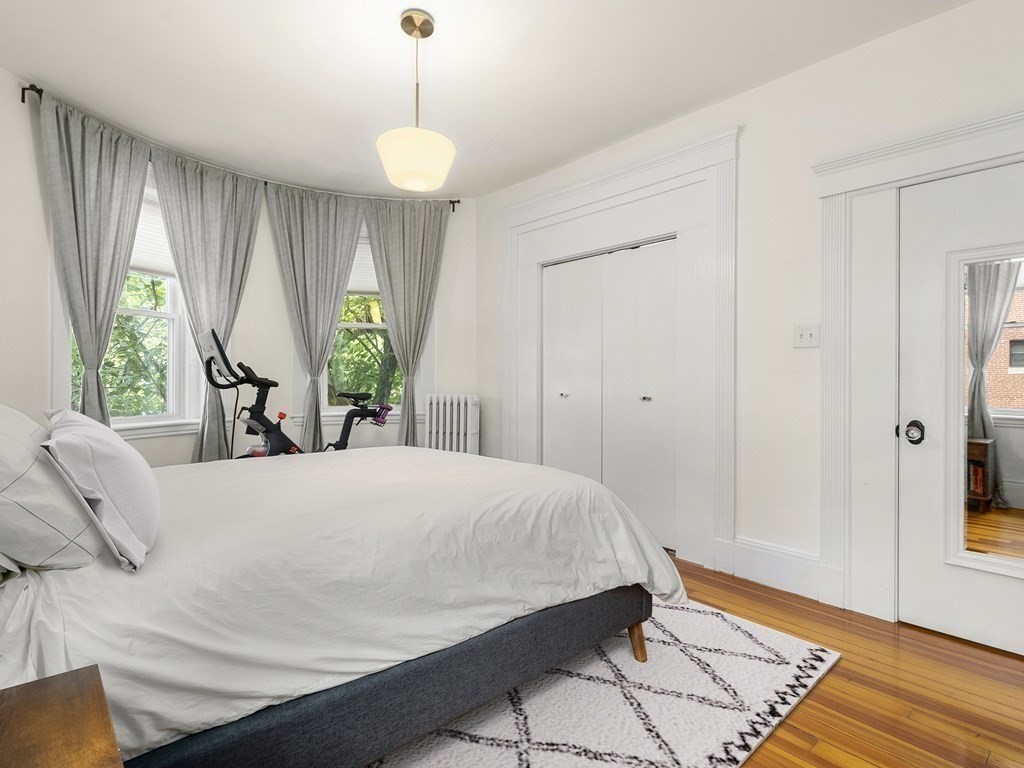 640 Washington Street, Unit 1 Brookline, MA 02446 - Photo 9 of 18 a bedroom with a bed and window