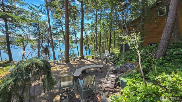 a view of backyard of house with seating space