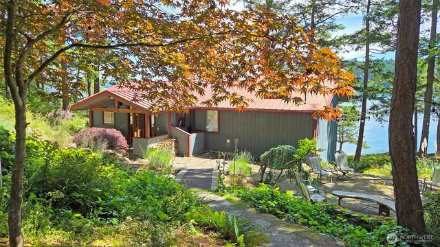 front view of a house with a tree