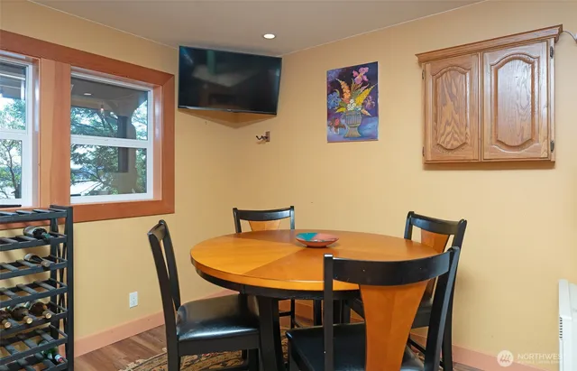 a view of a dining room with furniture window and wooden floor