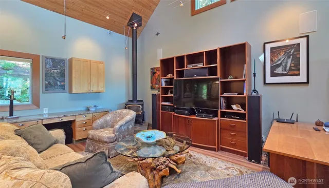 a living room with furniture workspace and a window