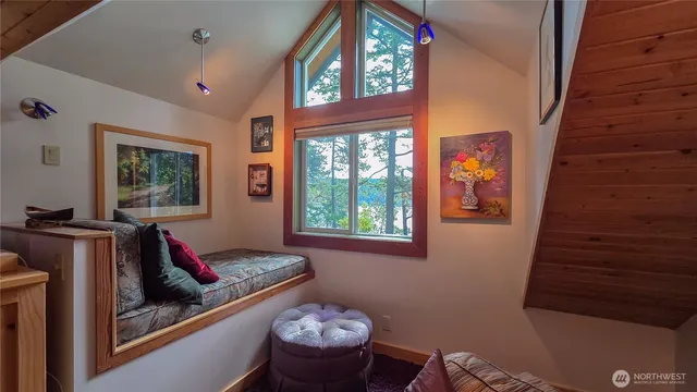 a room with furniture wooden floor and a flat screen tv