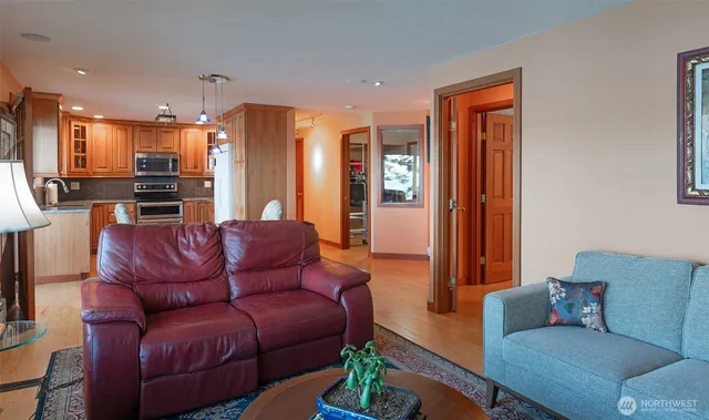 a living room with furniture or kitchen view and a wooden floor
