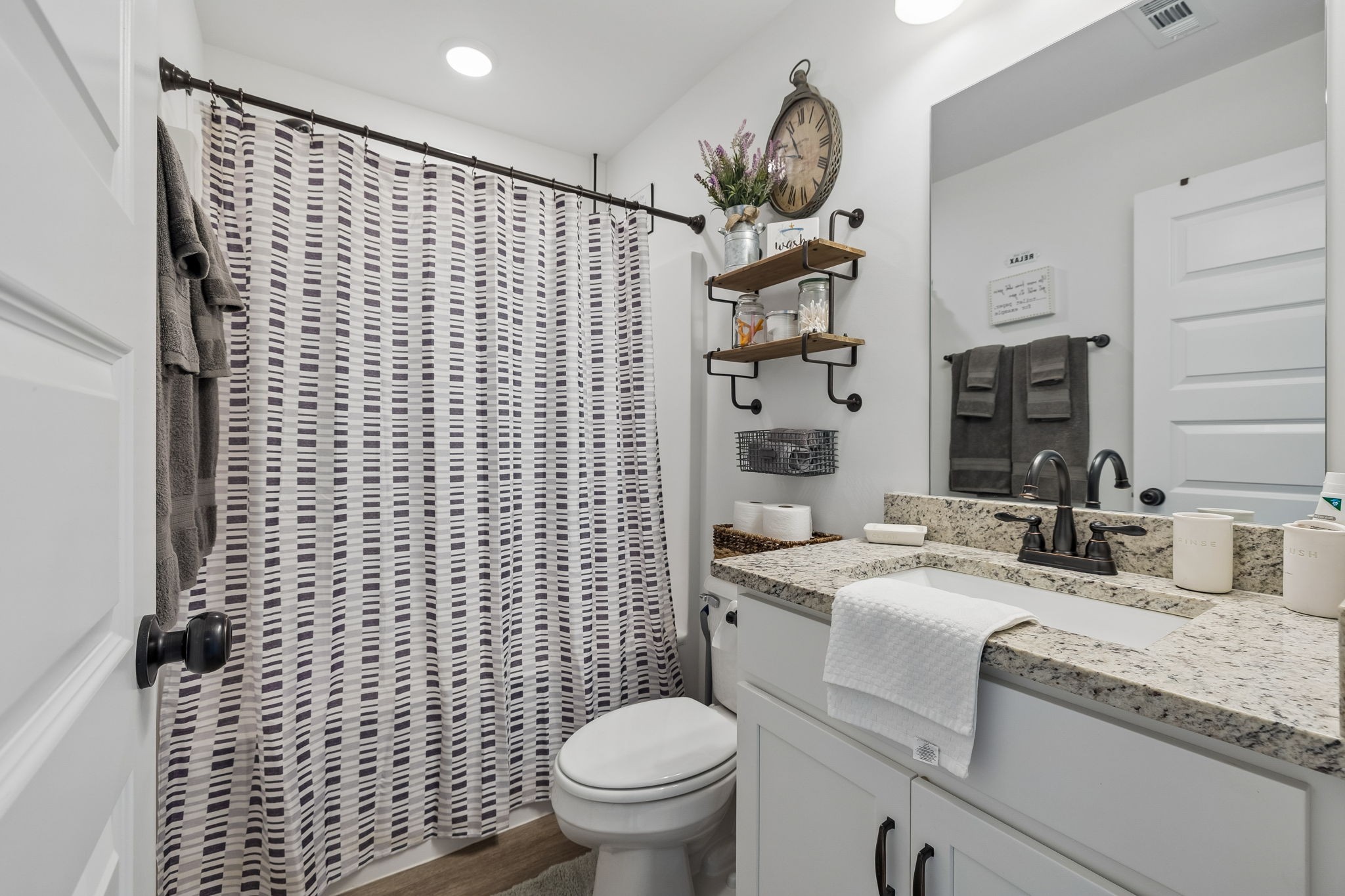 1180 Shaylee Drive Springfield, TN 37172 - Photo 13 of 46 a bathroom with a sink toilet vanity and shower