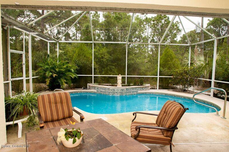 131 Haines Road Southwest Palm Bay, FL 32908 - Photo 6 of 24 Porch and Screen Pool