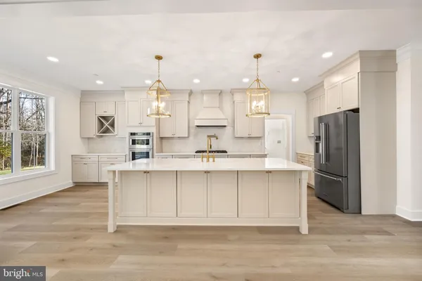 a view of an empty room and wooden floor