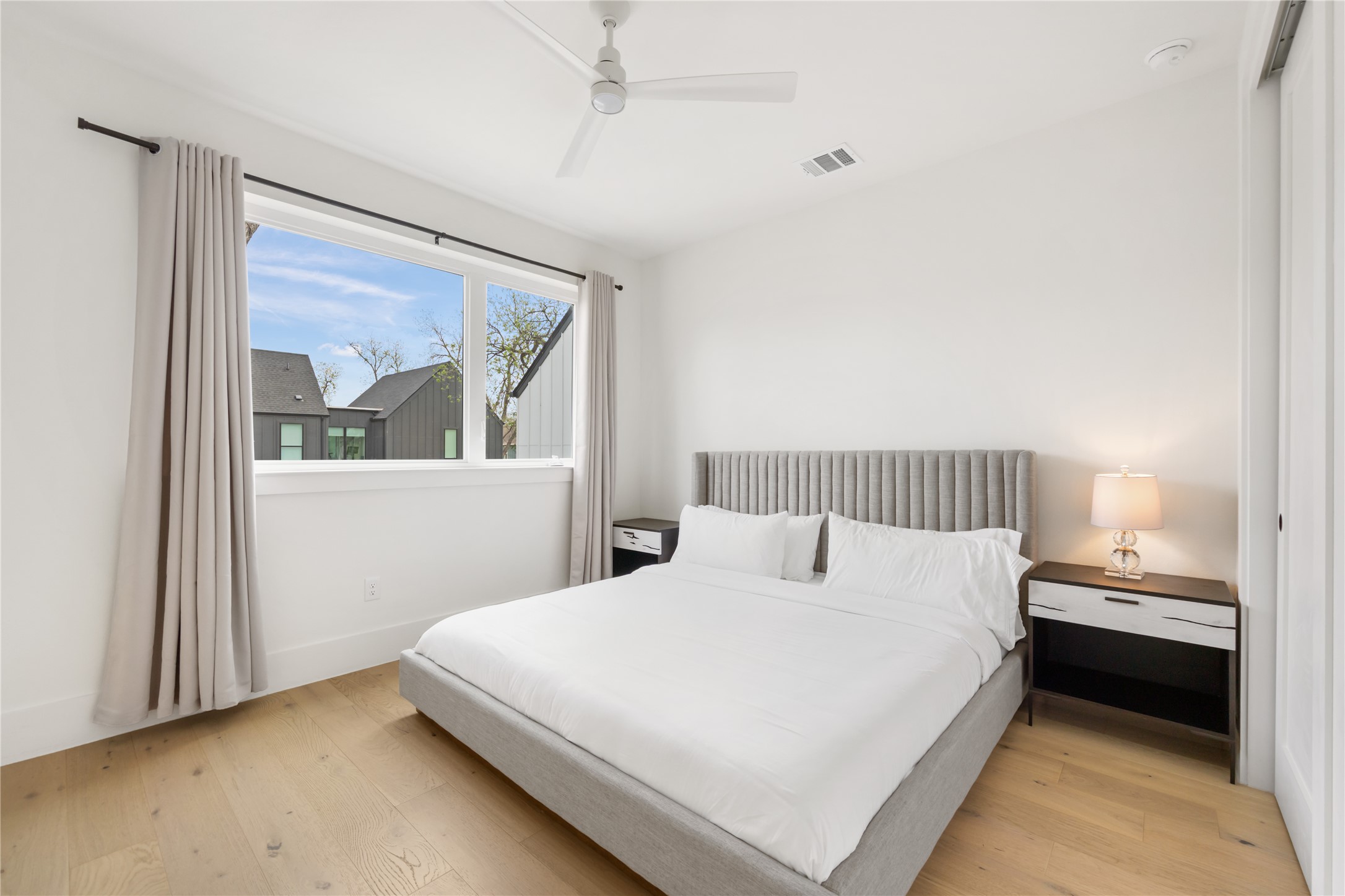 3201 Holton Street Austin, TX 78702 - Photo 24 of 39 Bright secondary bedrooms feature wide-plank wood floors and large windows