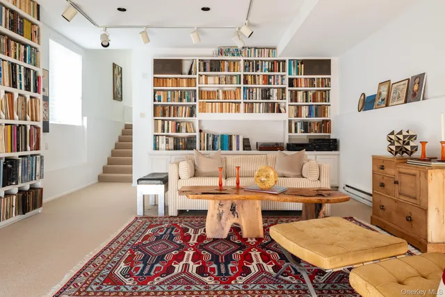 an aerial view of a residential houses with outdoor space and lake view