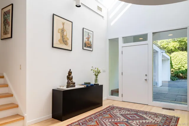 a view of a hallway with an entryway