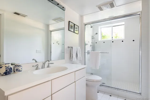 a work room with furniture and a large window