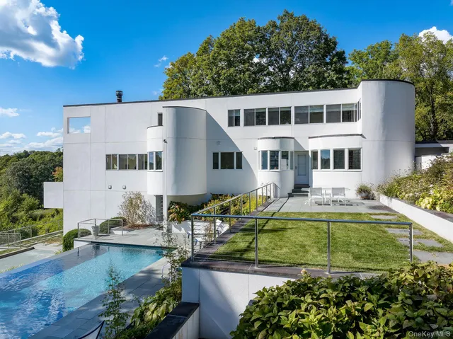 a view of a house with swimming pool