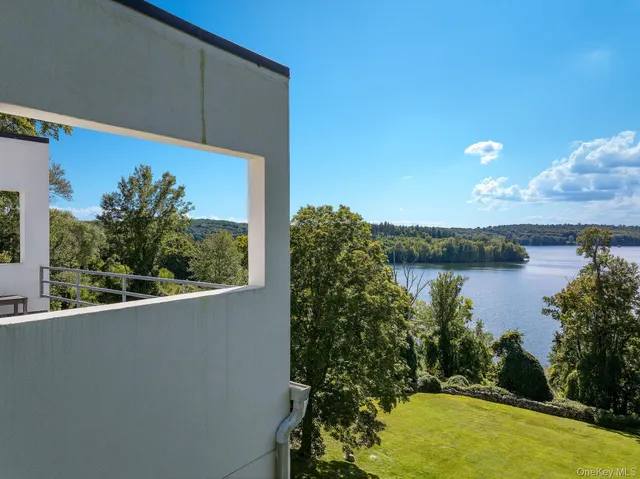 a view of a lake in a backyard
