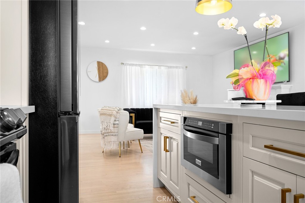 6625 Shadygrove Street Tujunga, CA 91042 - Photo 13 of 25 a kitchen with a sink cabinets and window