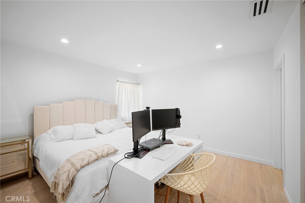 6625 Shadygrove Street Tujunga, CA 91042 - Photo 15 of 25 a bed room with a bed and chair