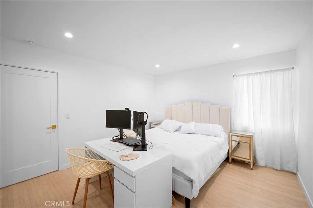 6625 Shadygrove Street Tujunga, CA 91042 - Photo 16 of 25 a bedroom with a bed and a table in it