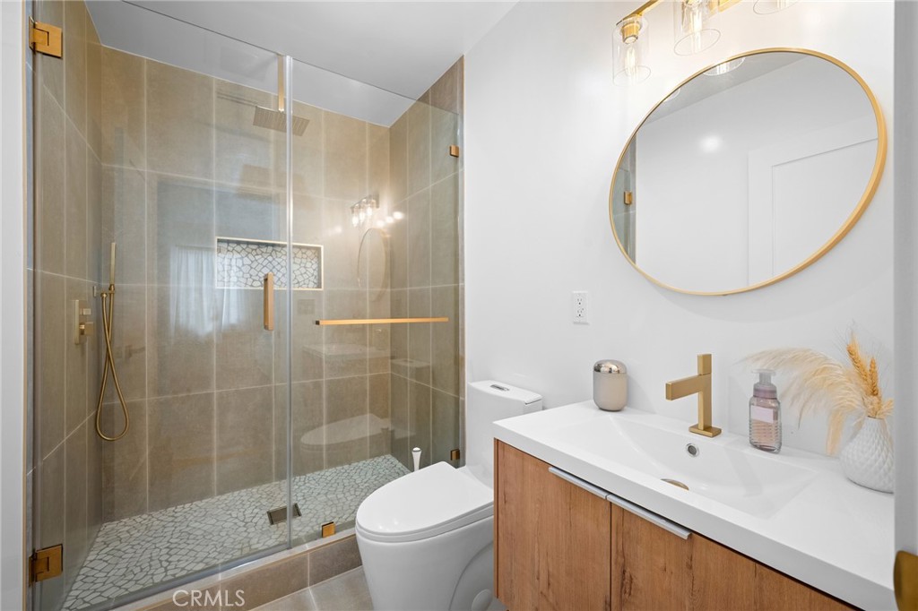 6625 Shadygrove Street Tujunga, CA 91042 - Photo 18 of 25 a bathroom with a sink a toilet and shower