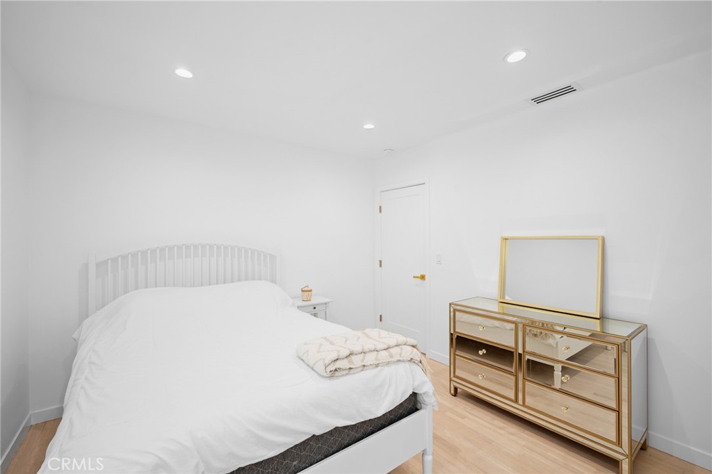 6625 Shadygrove Street Tujunga, CA 91042 - Photo 21 of 25 a bedroom with a bed and a dresser