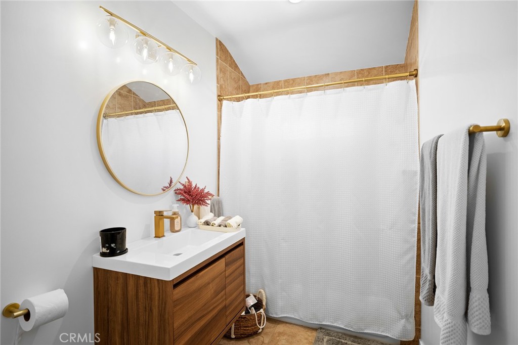 6625 Shadygrove Street Tujunga, CA 91042 - Photo 22 of 25 a bathroom with a sink vanity mirror and a mirror