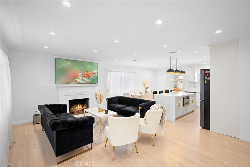 6625 Shadygrove Street Tujunga, CA 91042 - Photo 5 of 25 a living room with furniture and a fireplace