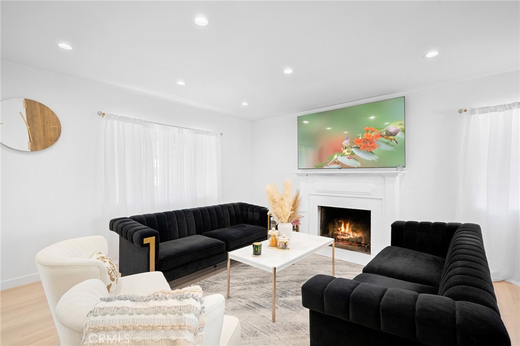 6625 Shadygrove Street Tujunga, CA 91042 - Photo 6 of 25 a living room with furniture and a fireplace