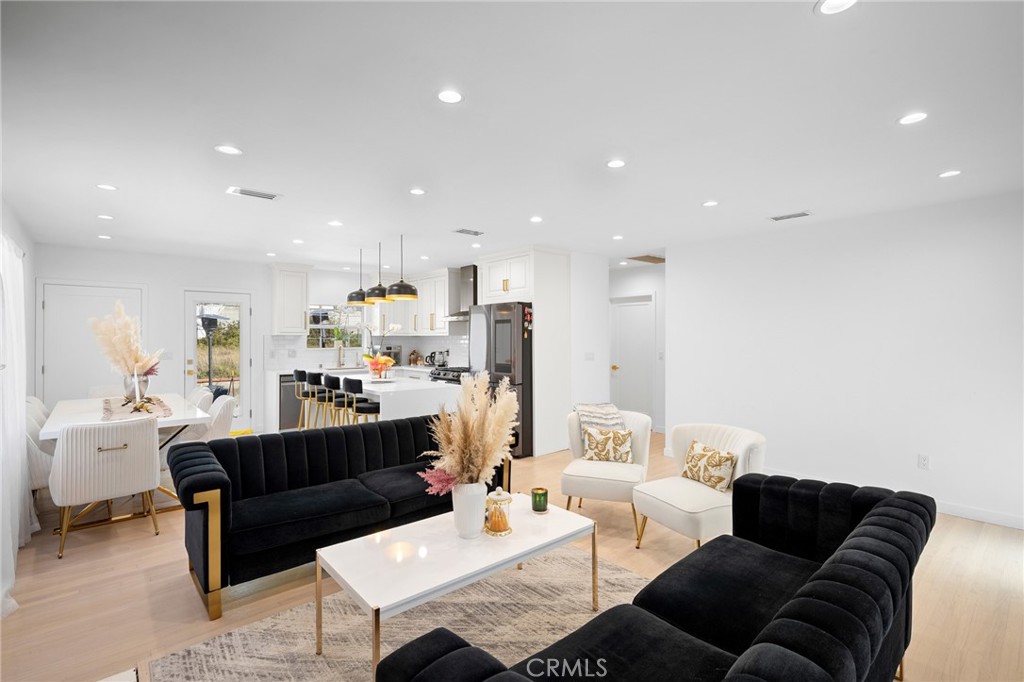 6625 Shadygrove Street Tujunga, CA 91042 - Photo 7 of 25 a living room with furniture kitchen view and a couch