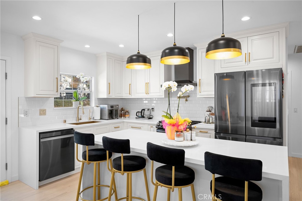 6625 Shadygrove Street Tujunga, CA 91042 - Photo 10 of 25 a kitchen with a sink cabinets and window