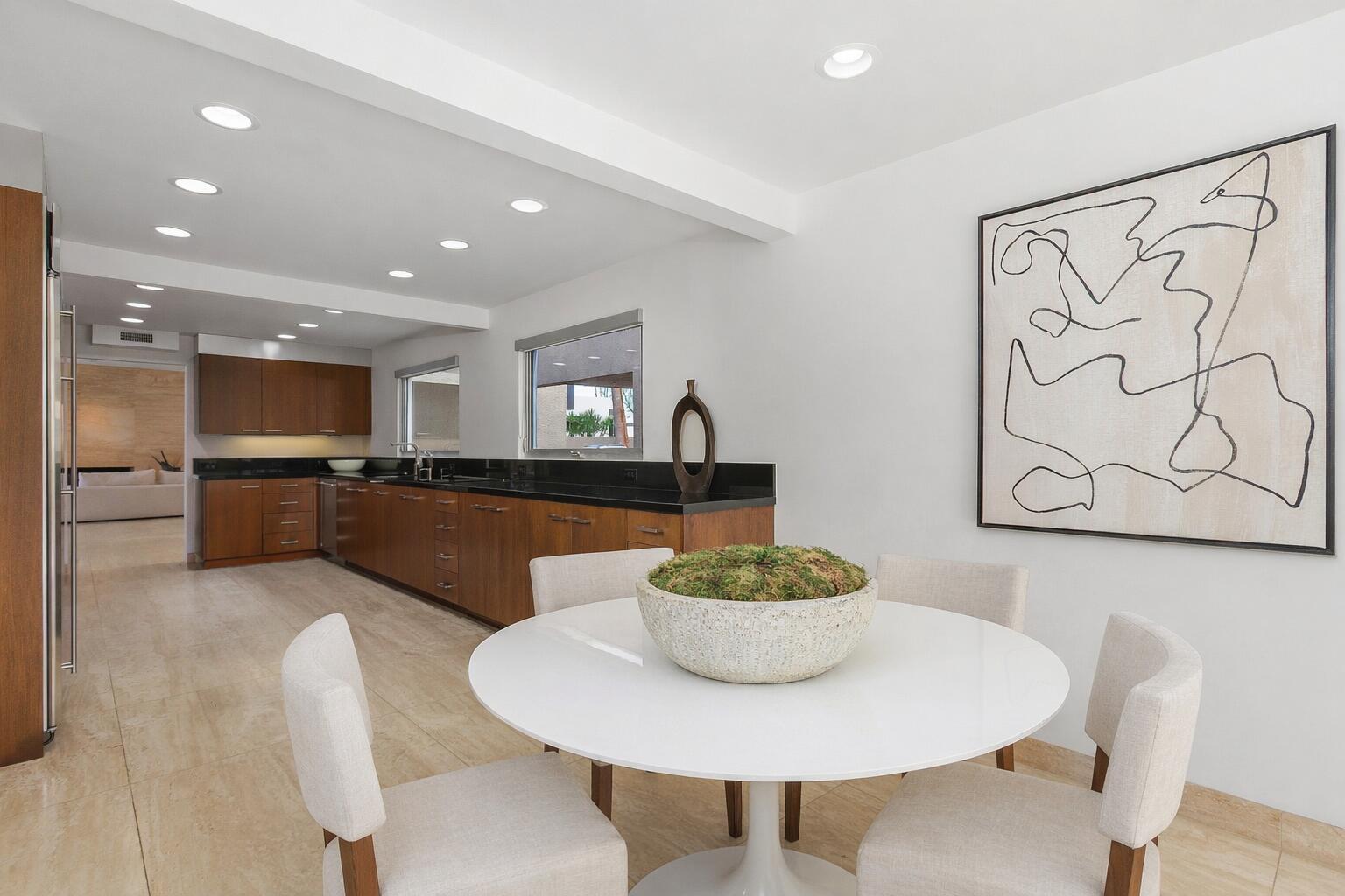 40231 Club View Drive Rancho Mirage, CA 92270 - Photo 15 of 53 a kitchen with a dining table and chairs