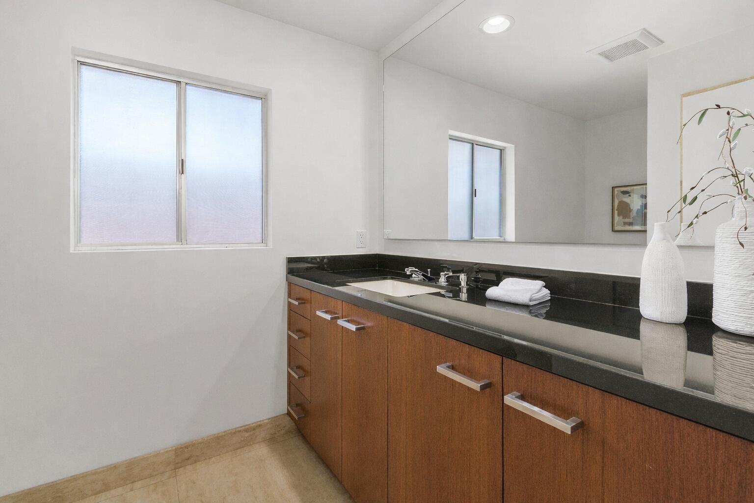 40231 Club View Drive Rancho Mirage, CA 92270 - Photo 17 of 53 a bathroom with a sink and a mirror