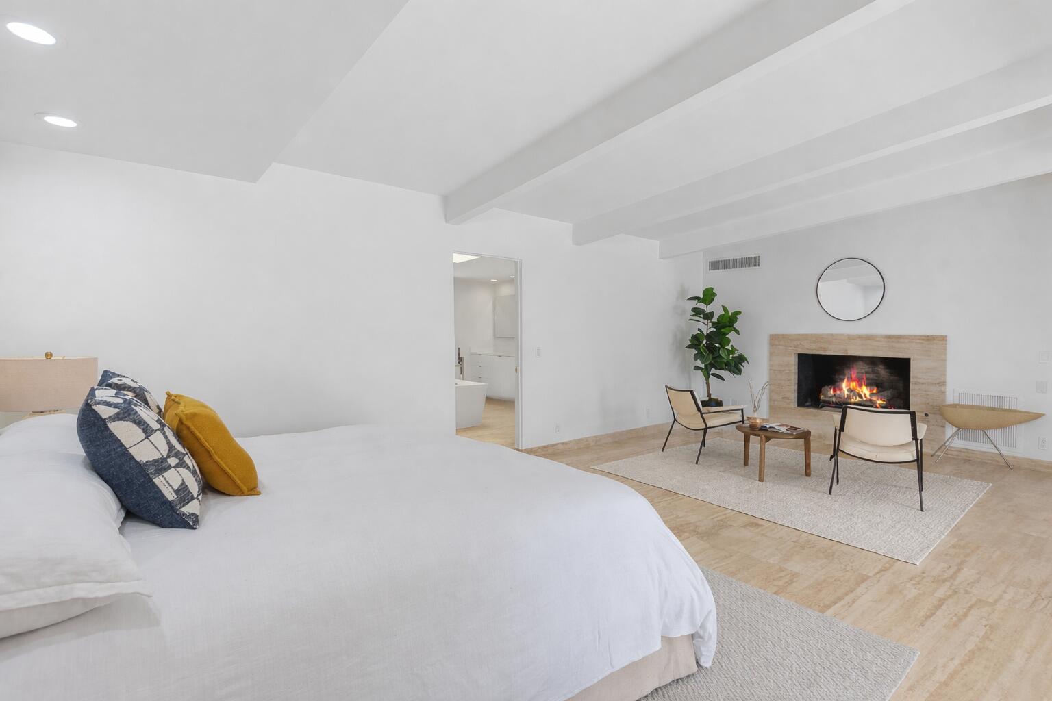 40231 Club View Drive Rancho Mirage, CA 92270 - Photo 26 of 53 a bedroom with a bed and a chair