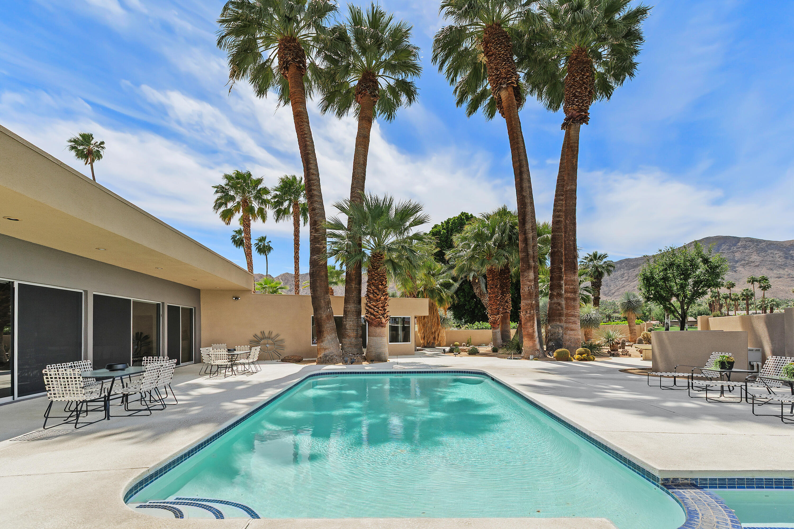 40231 Club View Drive Rancho Mirage, CA 92270 - Photo 40 of 53 a view of a backyard with palm trees