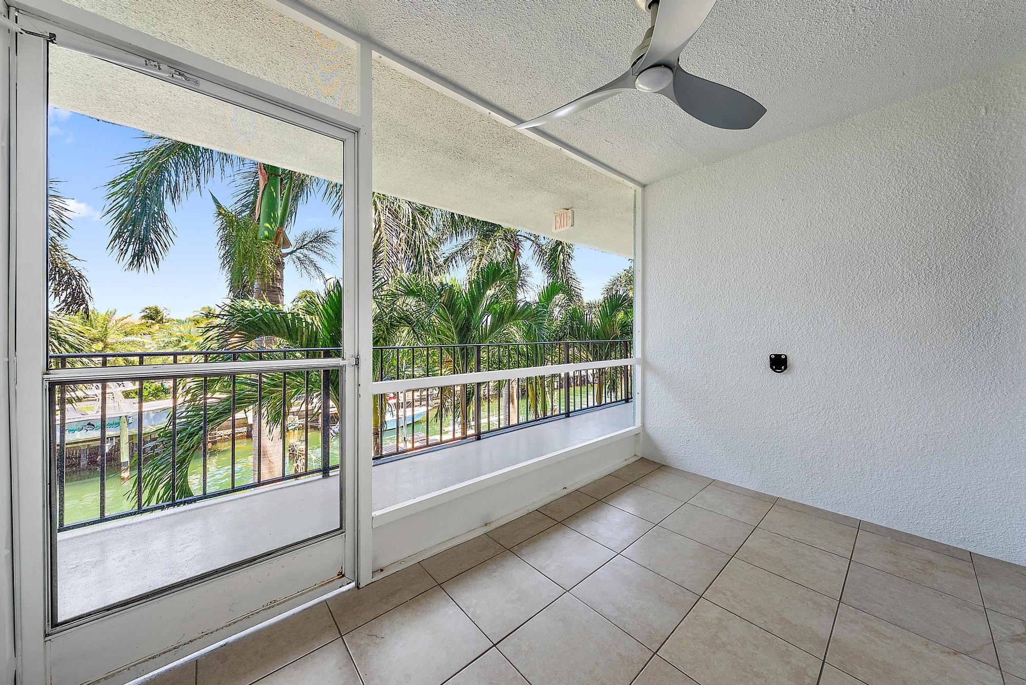 109 Paradise Harbour Boulevard, Unit 307 North Palm Beach, FL 33408 - Photo 4 of 20 Screened in patio:water view