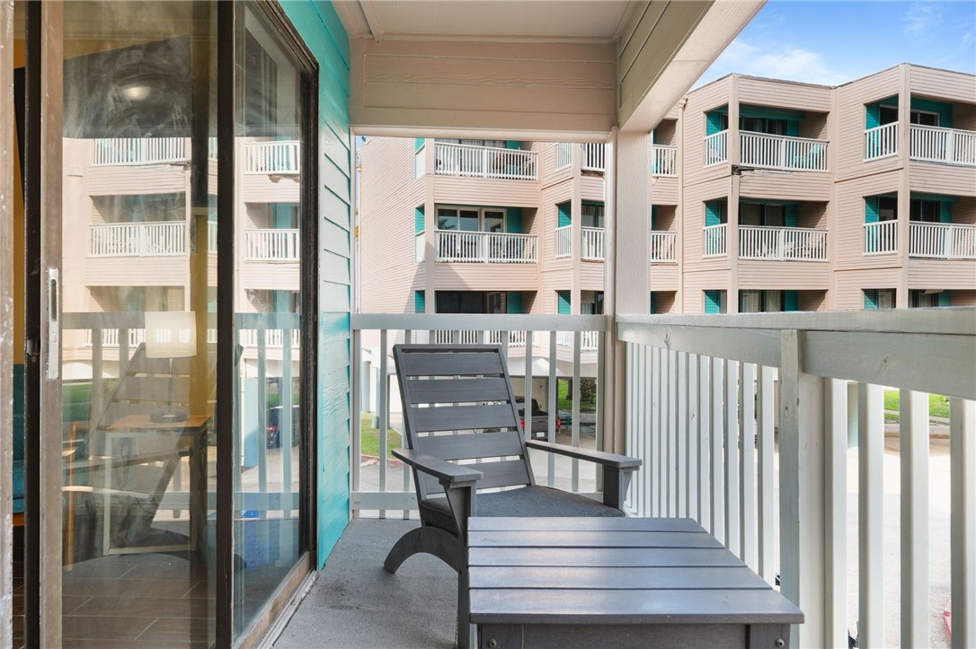 3938 Surfside Boulevard, Unit 1139 Corpus Christi, TX 78402 - Photo 11 of 14 a view of a building with a bench