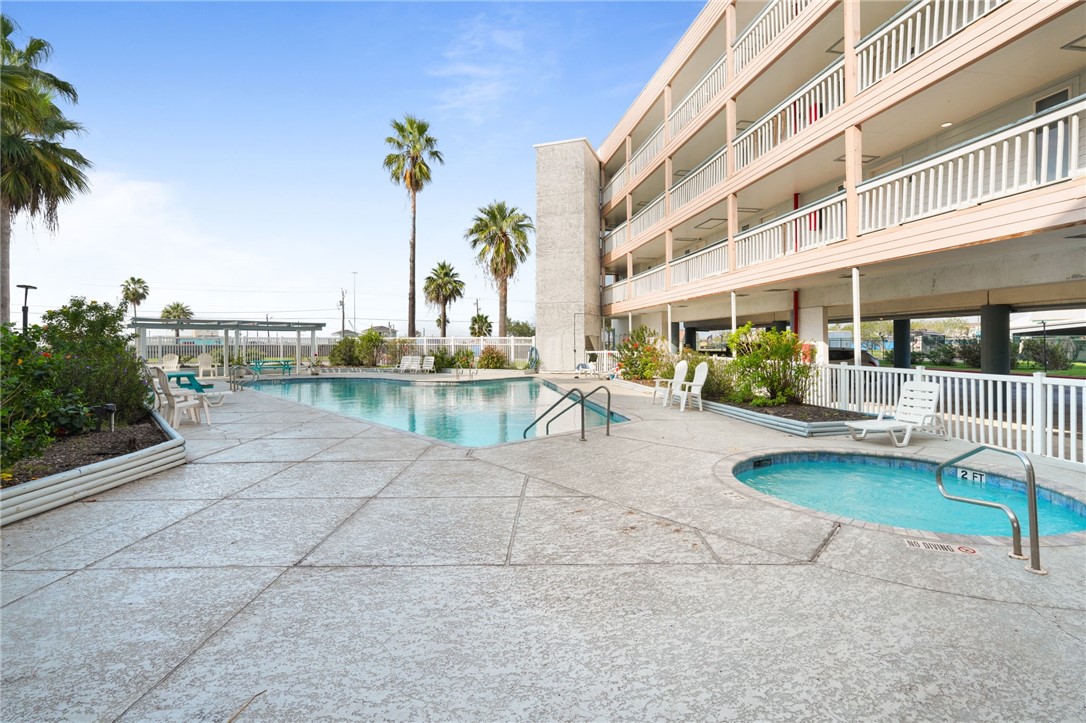 3938 Surfside Boulevard, Unit 1139 Corpus Christi, TX 78402 - Photo 13 of 14 a view of a building with garden