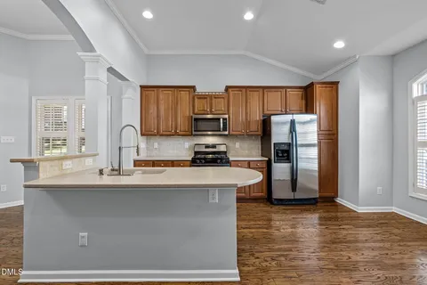 a view of kitchen with furniture wooden floor and window
