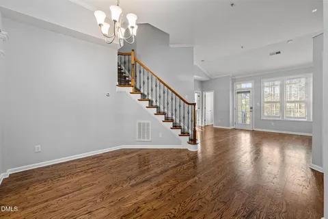 a kitchen with granite countertop a stove a sink and a microwave