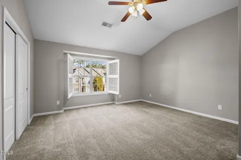 a bathroom with a double vanity sink a toilet and a mirror