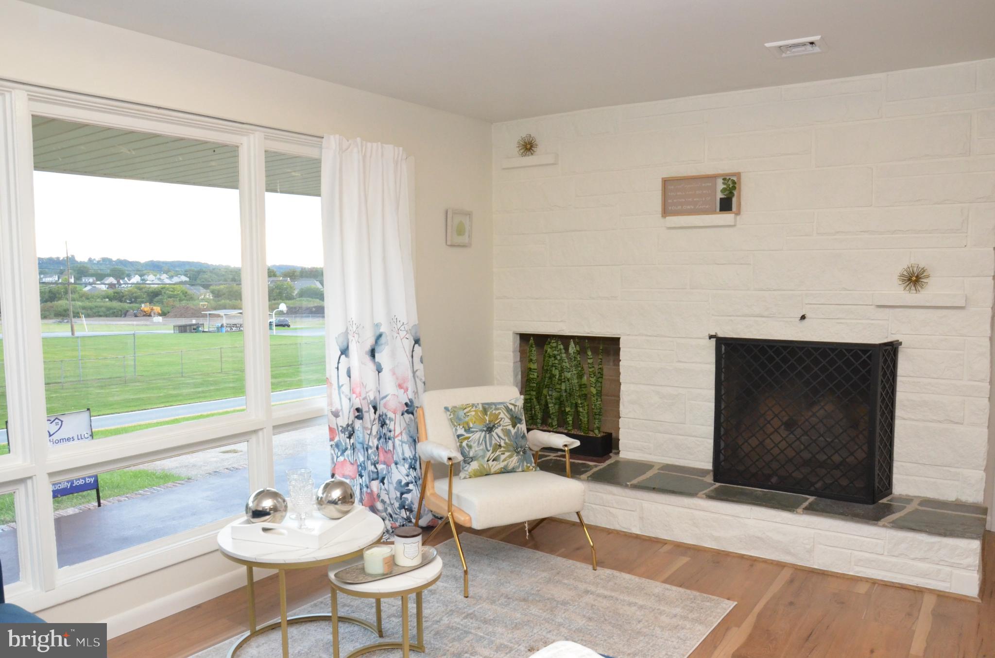 6620 Conway Road Harrisburg, PA 17111 - Photo 28 of 29 Fire place and log holder in the living room